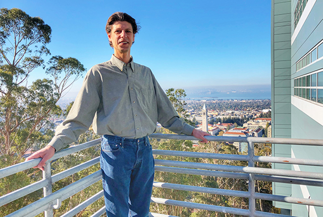 Scientist Sean Peisert stands on balcony