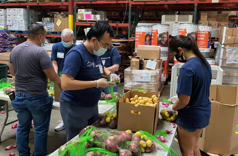 image of Lab employees filling boxes at food bank