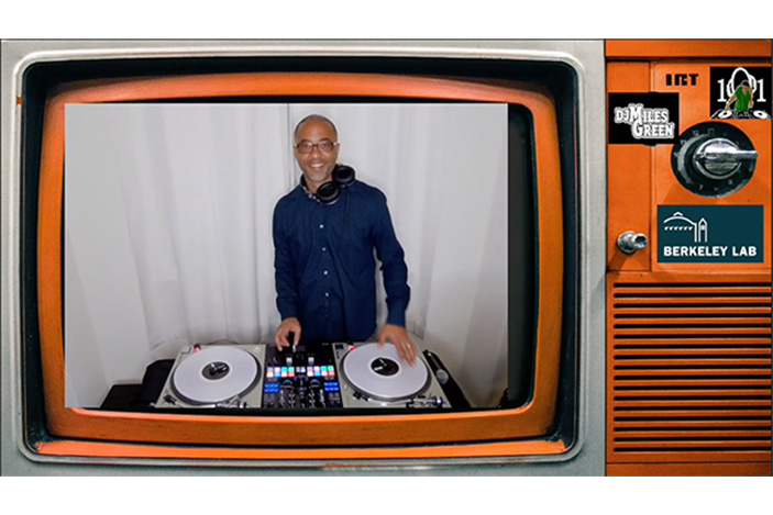 1950s television set showing man with dj turntables