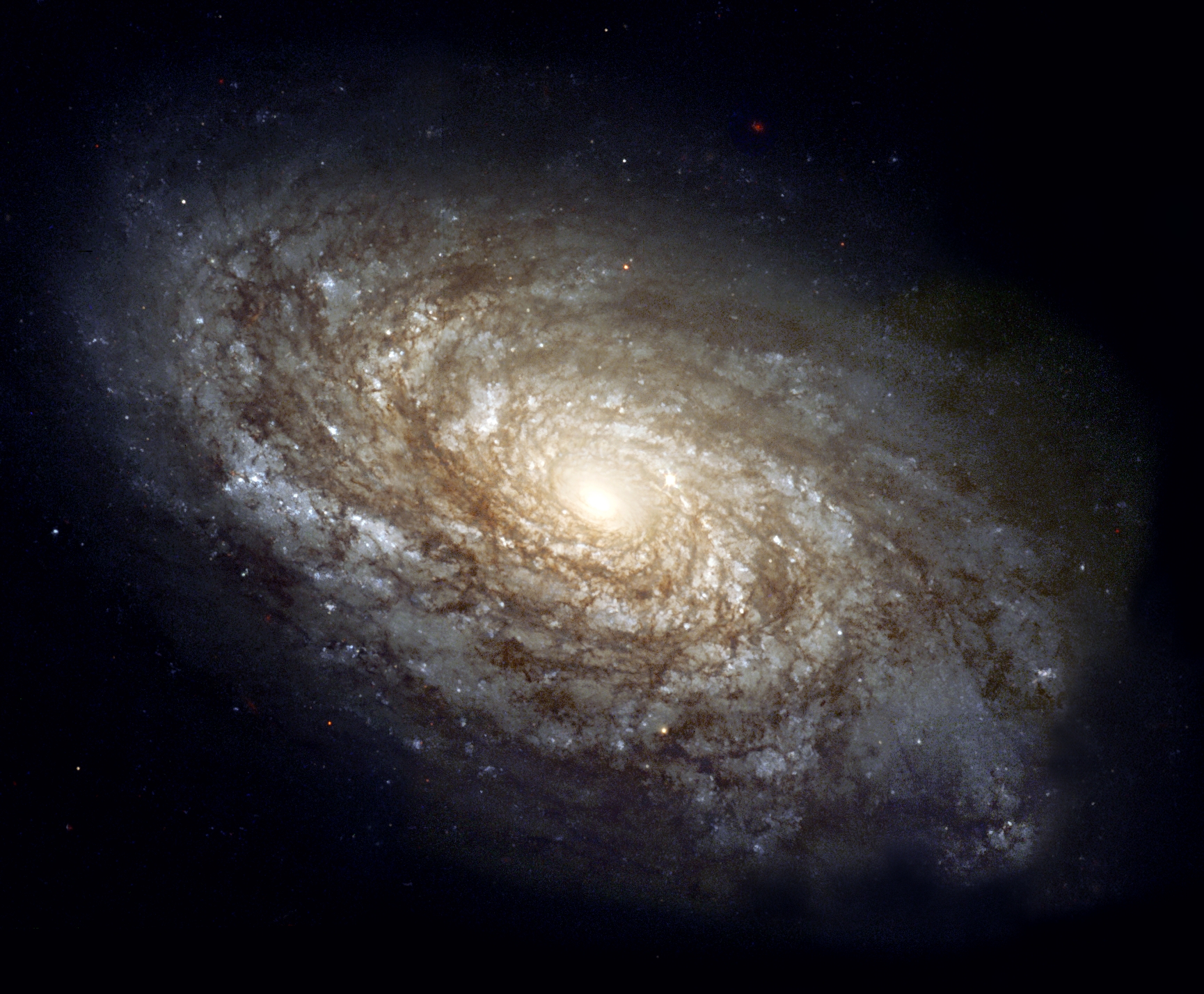 NGC 4414, a typical spiral galaxy in the constellation Coma Berenices, is about 55,000 light-years in diameter and approximately 60 million light-years from Earth.