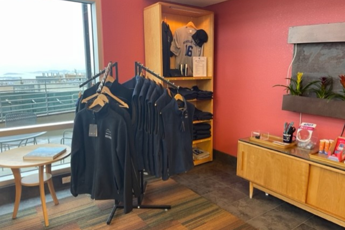 image of a rack of Berkeley Lab logo sweatshirts in the Guest House lobby