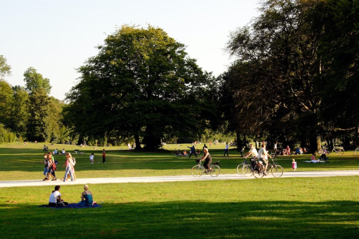 walkers and cyclists in a park