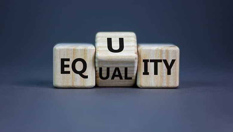 Wooden blocks spelling equality and equity