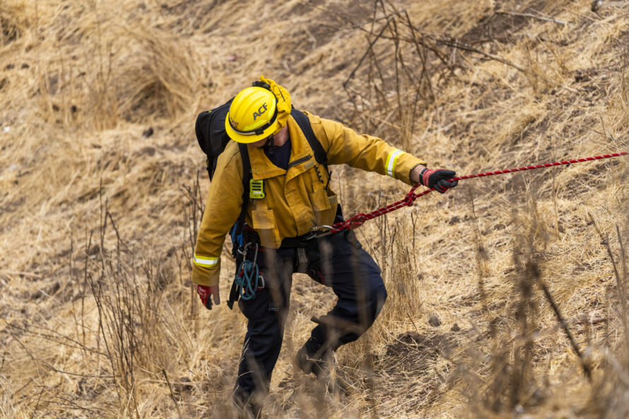 firefighter on steep hillside