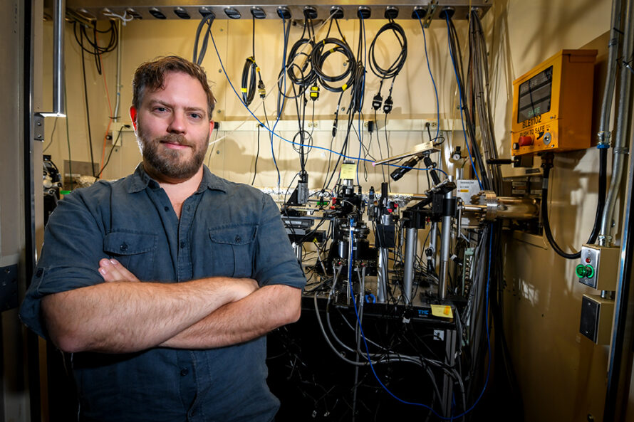 man standing in front of scientific equipment