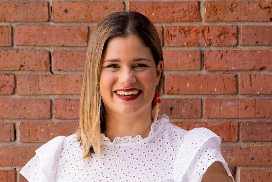 Headshot photo of Dr. Mónica Feliú-Mójer smiling and wearing a white blouse.