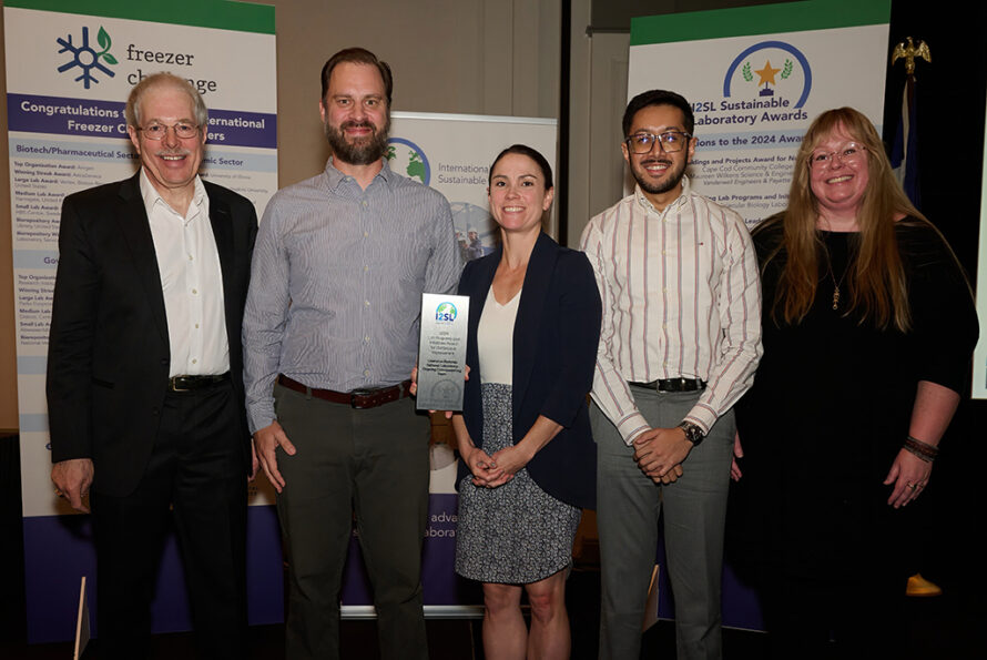 Group photo of Berkeley Lab team members receiving a sustainability award at the I2SL Sustainable Laboratory Awards ceremony