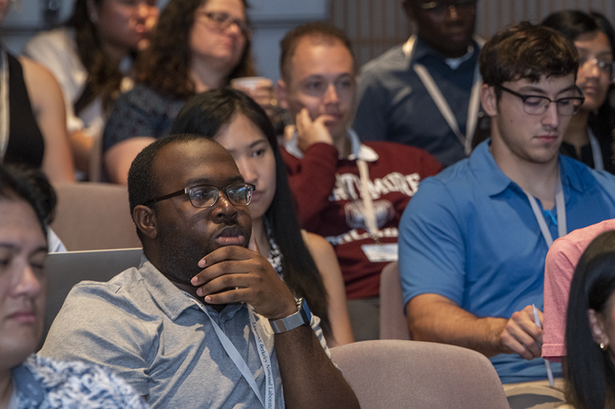 Group of interested attendees listening to a lecture