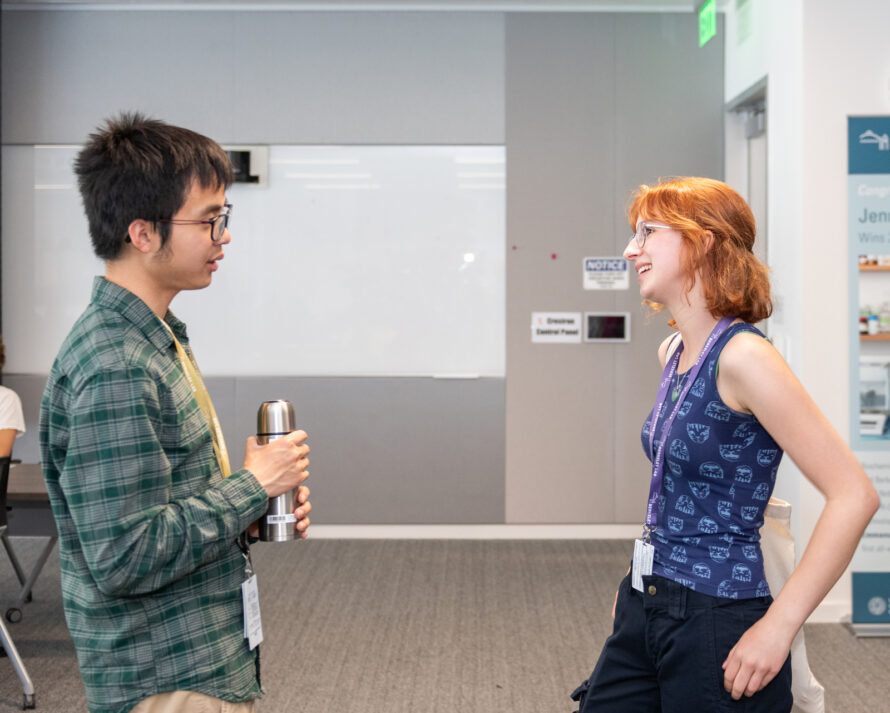 Two participants engage in a discussion during a Berkeley Lab Teaching Scholars program session.