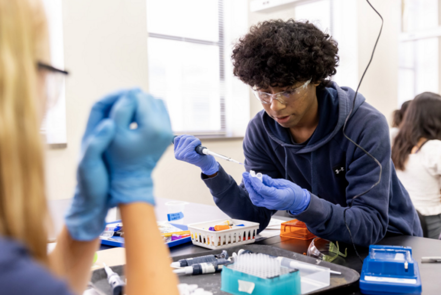 Person in laboratory using scientific equipment