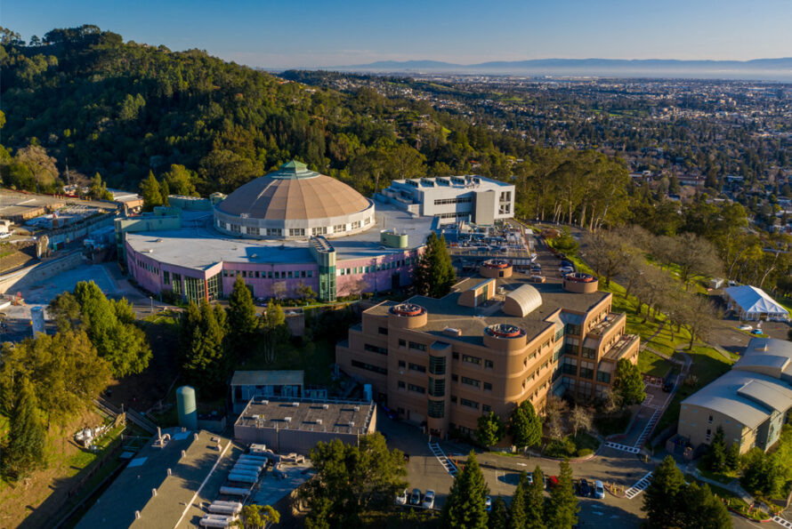 An aerial view showing the Advanced Light Source (ALS, Building 6), Building 2, and the surrounding buildings of the ALS complex as seen from an aerial photography drone at Berkeley Lab.