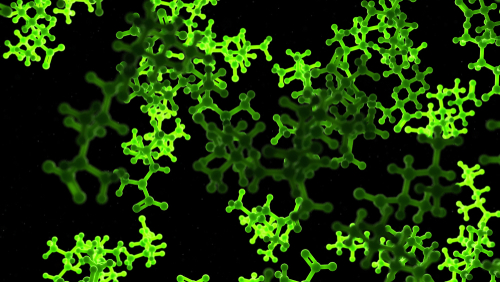 3D rendering of fluorescent green spindles representing amino acids