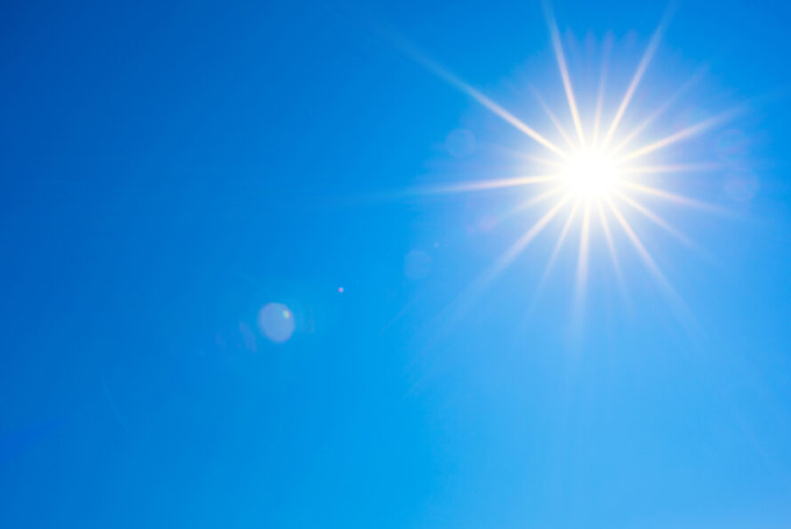 Bright sun against a clear blue sky.