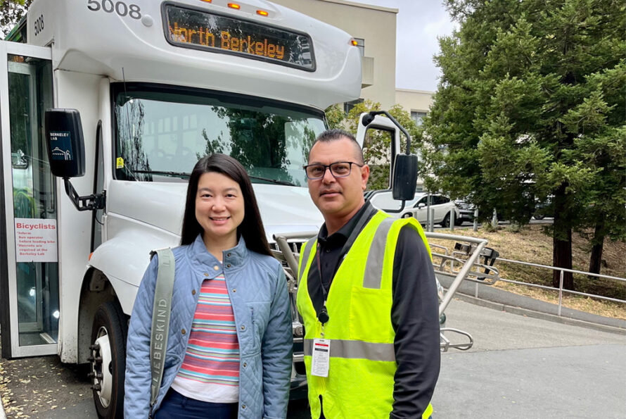 Shuttle rider Cindy Lee, left, and shuttle driver Rogelio Martinez, smile for a photo in front of the North Berkeley shuttle.