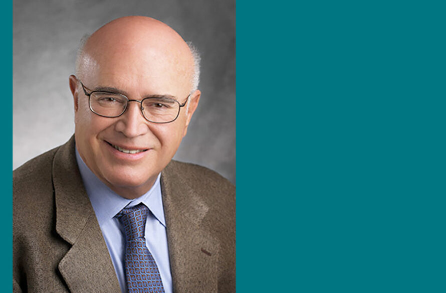 Person wearing brown suit jacet on teal background