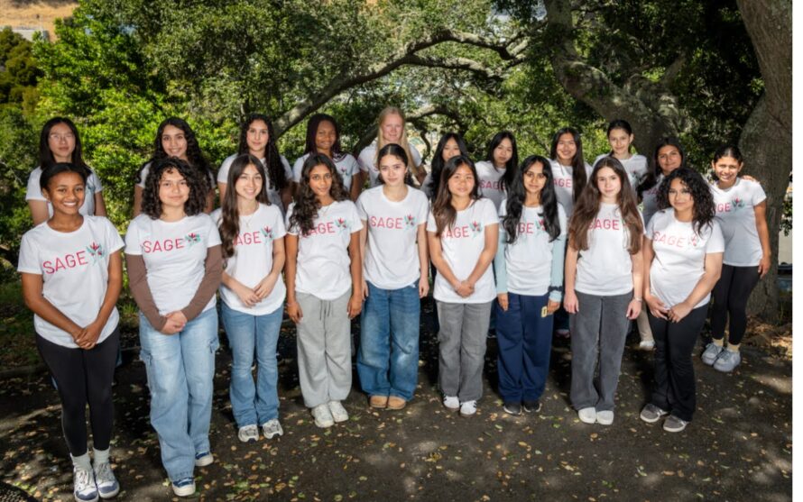 Group of young people standing in line outside