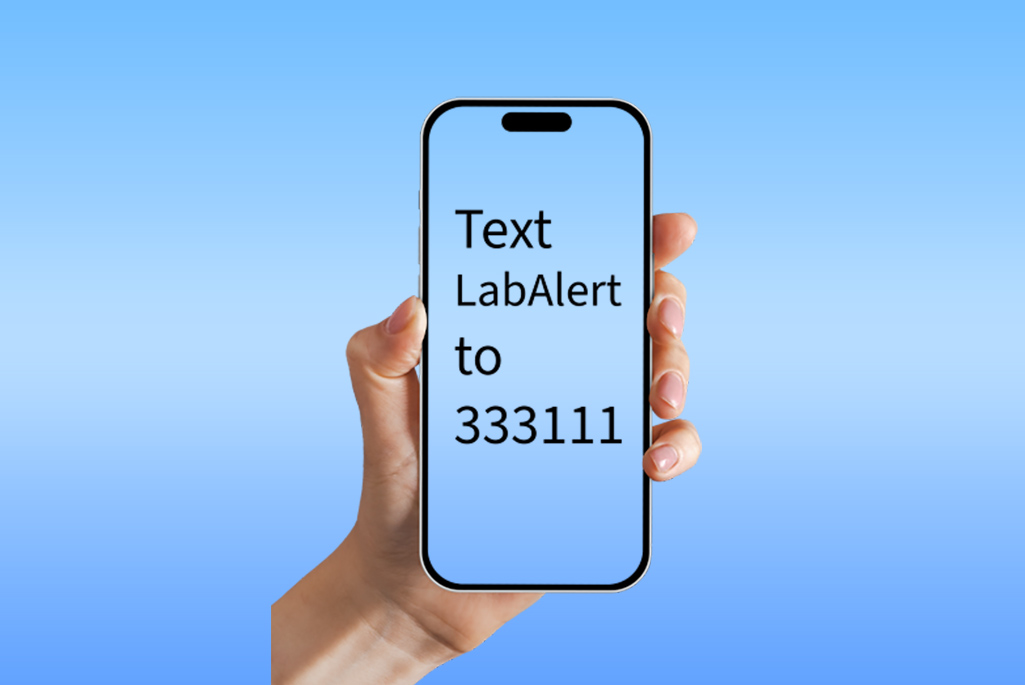 Hand holding outline of mobile phone against a blue background