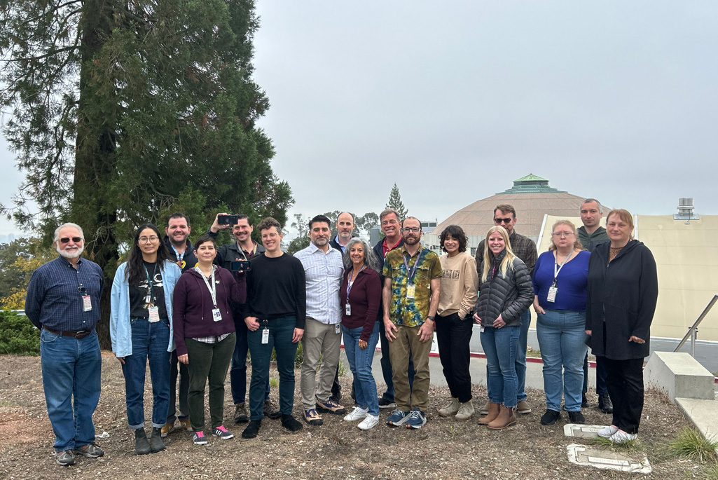 Group photo of radiation protection professionals at the Lab with the ALS dome in the background.