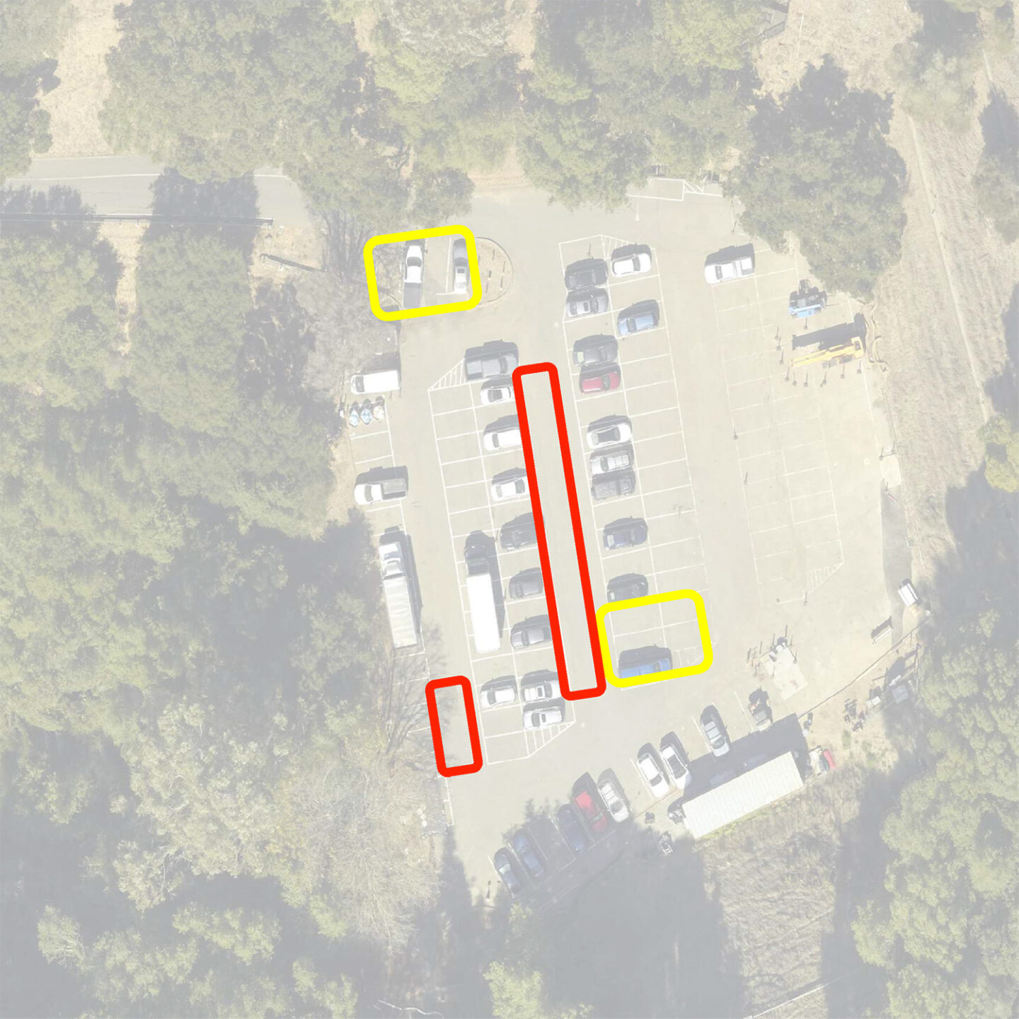 Aerial view of parking lot D with markings around parking spaces and aisles designated for surface repair.
