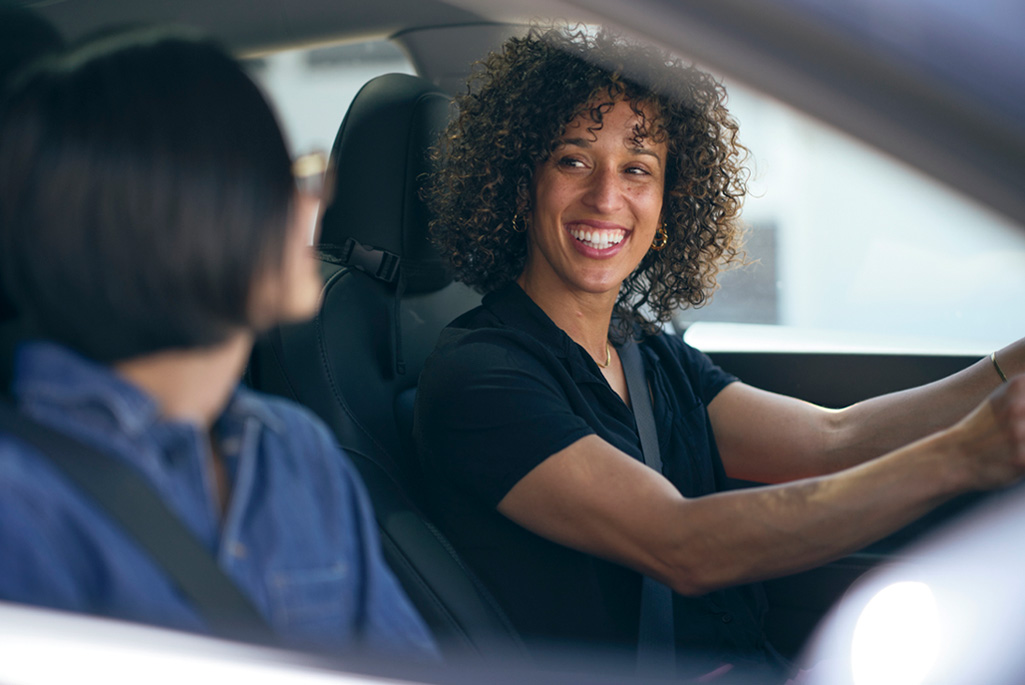 Two people driving together in a car.