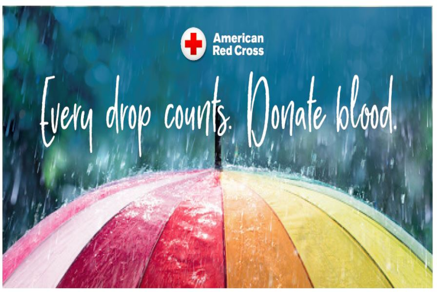 Closeup photo of a multi-colored umbrella beneath words in cursive font reading "Every drop counts. Donate blood." and red and white Red Cross logo at the top