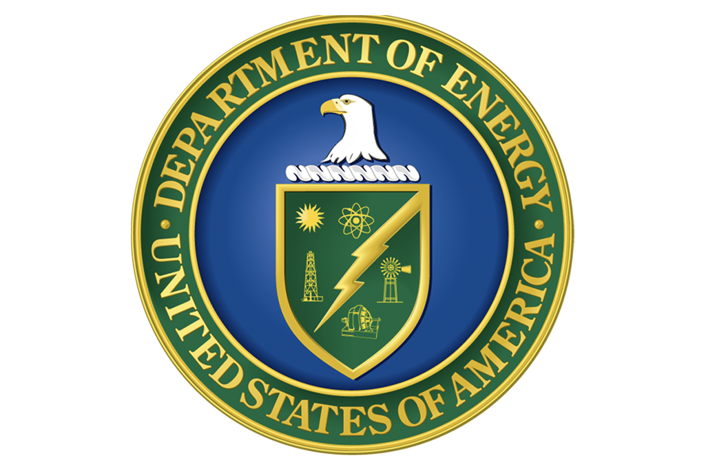 Logo of eagle on shield on blue background with gold lettering on green background encircling shield reading Department of Energy United States of America