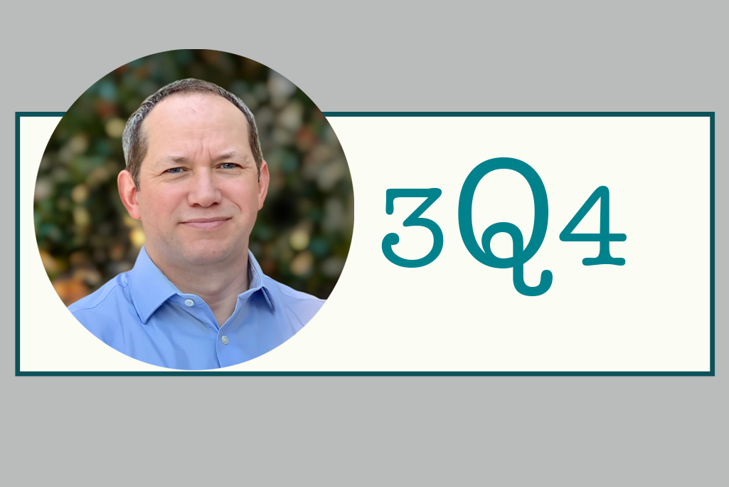 Headshot of Alistair Rogers against a background printed with 3Q4