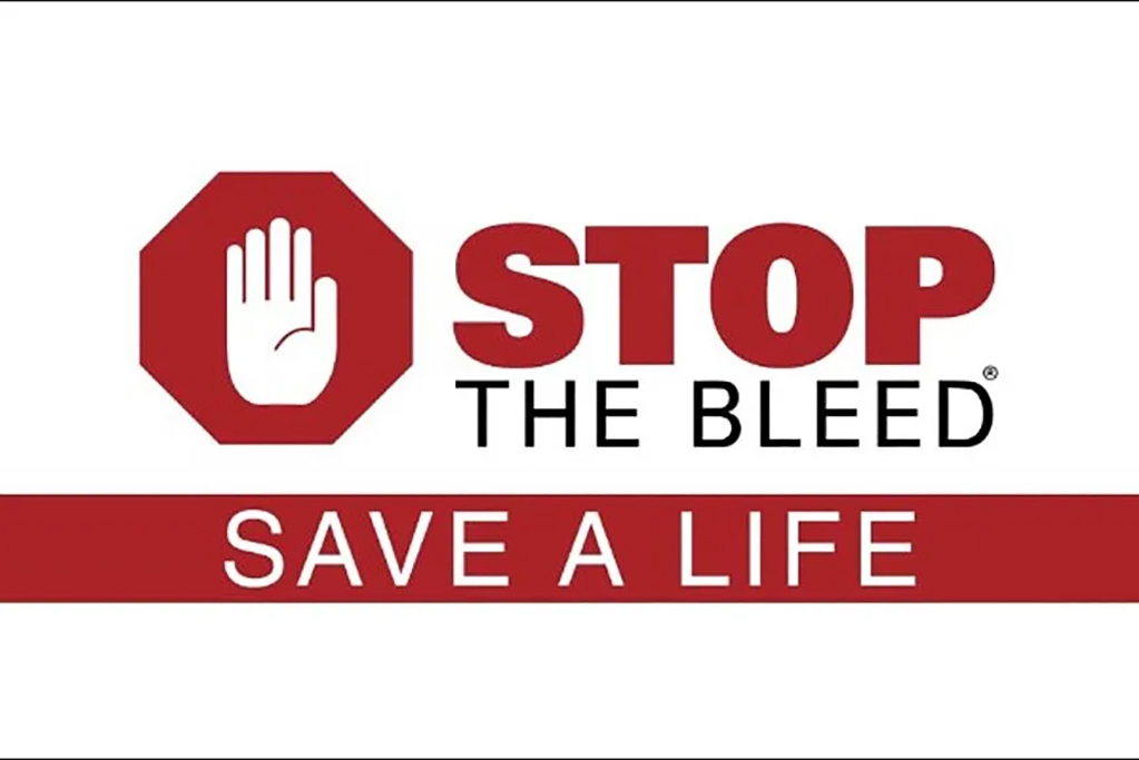 Text on white background stop the bleed with hand inside octagon shape