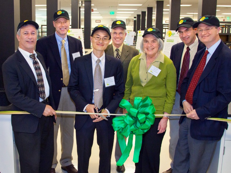 Group of people at ribbong cutting