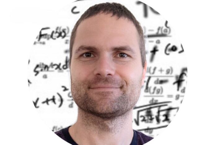 Headshot of person with short black hair framed in a circular portrait background of mathematical equations