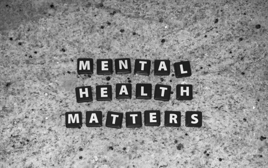 Three lines of black-and-white tiled letters spelling "MENTAL" on first line, "HEALTH" on second line, and "MATTERS" on third line, all on gray background