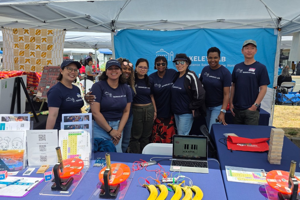 Group of people in Lab t-shirts standing in festival booth