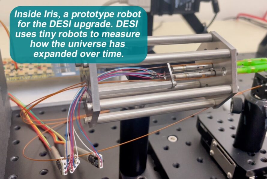 Closeup of Iris prototype robot represented by steel cylindrical rods fixed to a horizontal base with wires protruding from the center