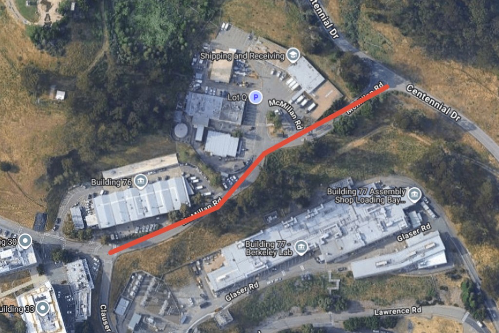 Aerial view of Berkeley Lab with a red line drawn through McMillan Road indicating road closure.
